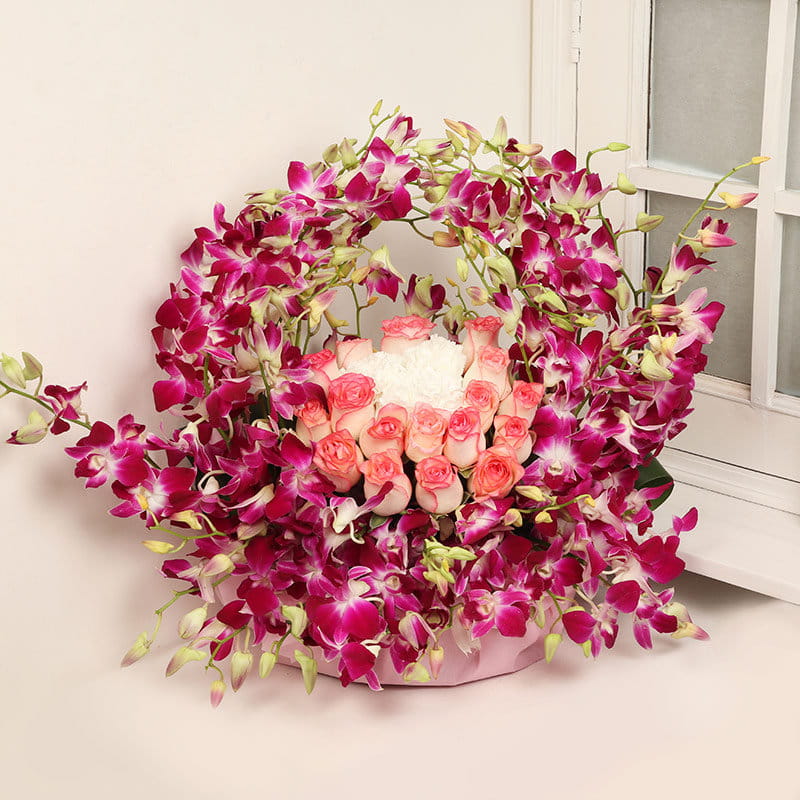 Pretty Rose and purple Orchid Arrangement